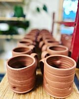 Processing Red Clay Mugs.